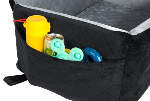 Side pockets holding pet travel essentials